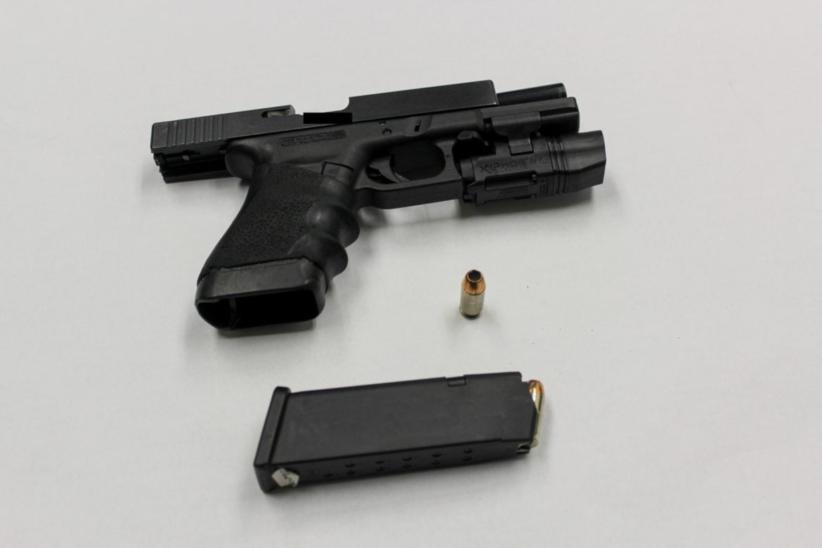 Ofc. McMahon's .45-caliber Glock 21 pistol is seen in an evidence photo after he used it to kill Ronell Foster, a 33-year-old father of two, on Feb. 13, 2018.
