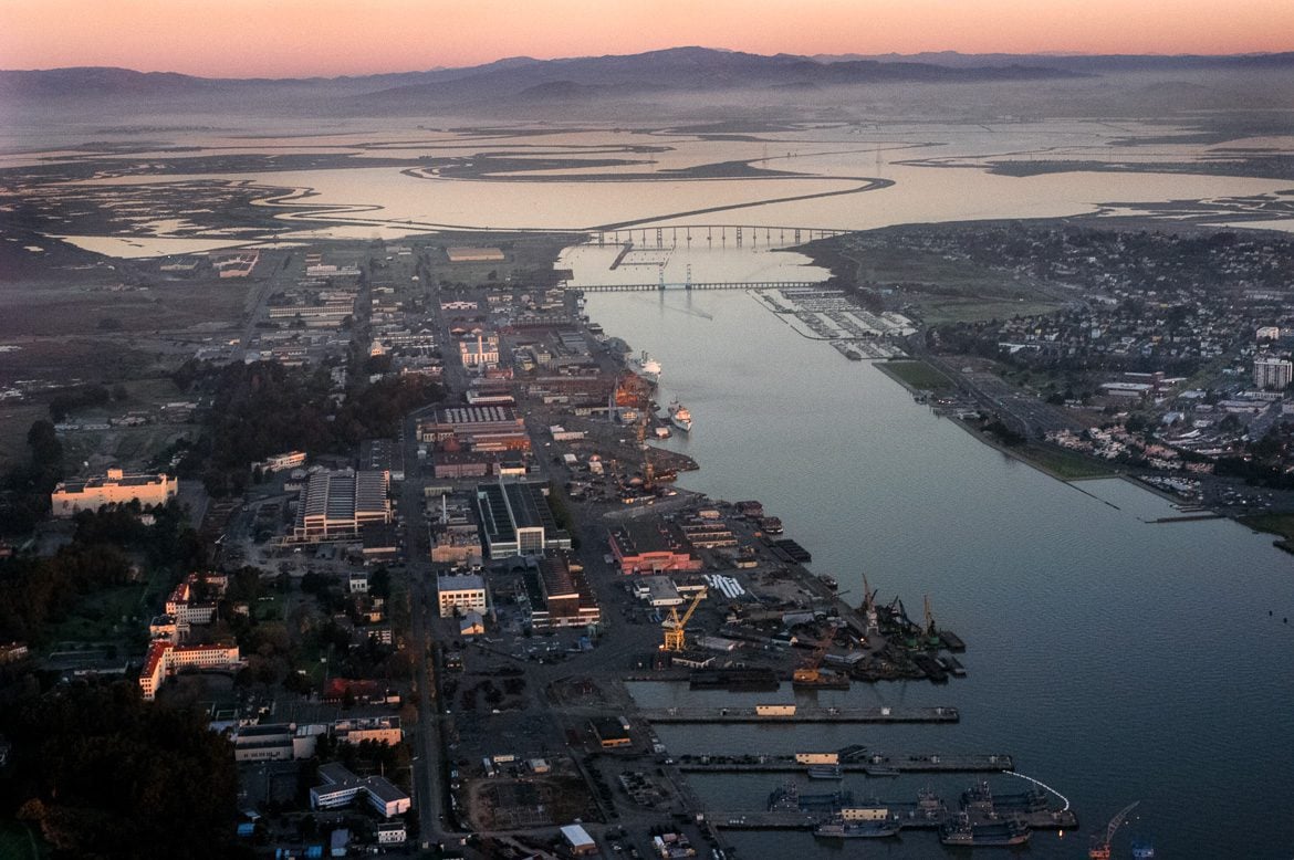 An aerial view of Mare Island, seen looking north, in 2004. The Napa River becomes Mare Island Strait as it flows past the former naval shipyard.