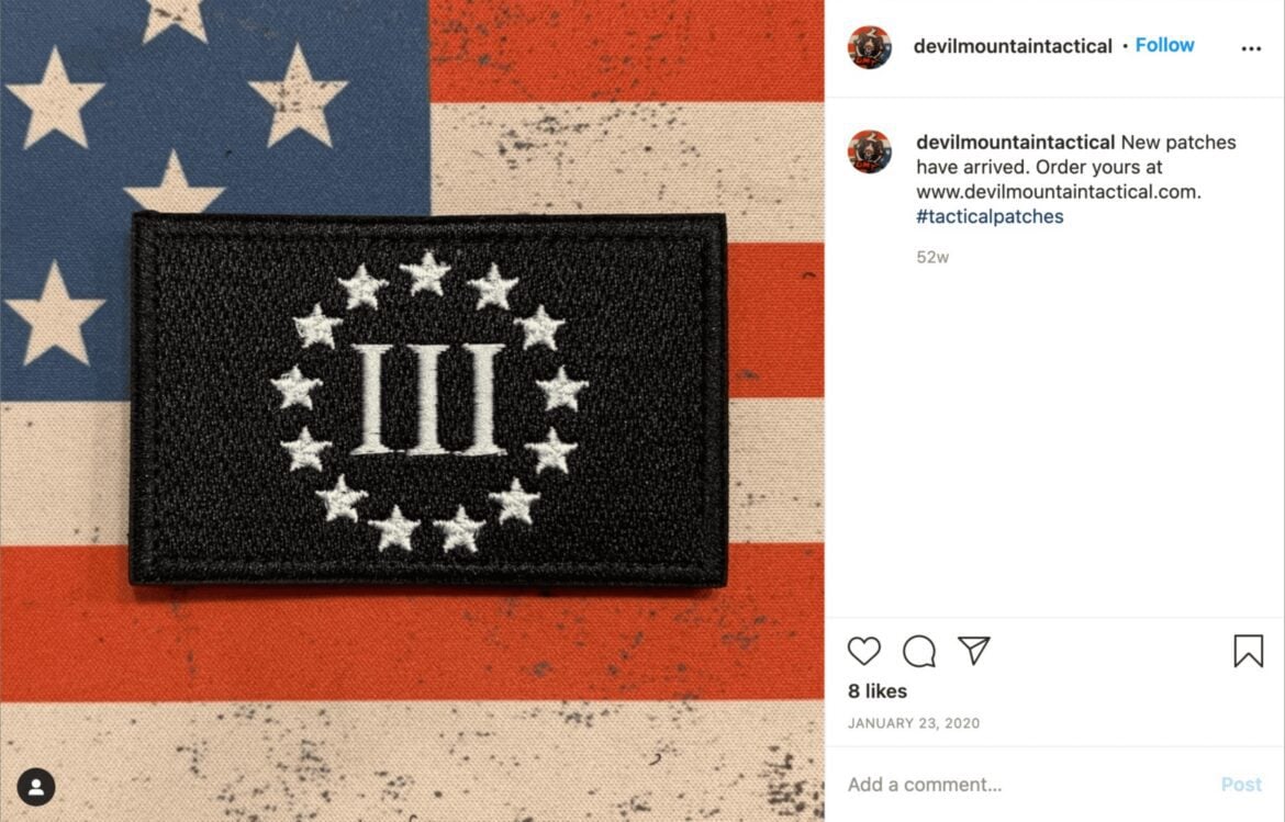 A screenshot from Instagram depicting a close-up image of a Three Percenter militia patch.