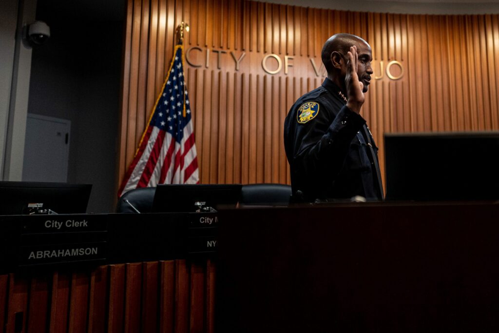 Vallejo Police Chief Shawny Williams is sworn into office under the gaze of a city surveillance camera on Nov. 12, 2019. A BuzzFeed News investigation found that Vallejo was one of more than 1,800 public entities to use a facial recognition technology so powerful, it is the subject of numerous lawsuits and several government probes. A Vallejo police spokesperson said the department’s command staff were unaware of its use prior to being contacted for comment by Open Vallejo.