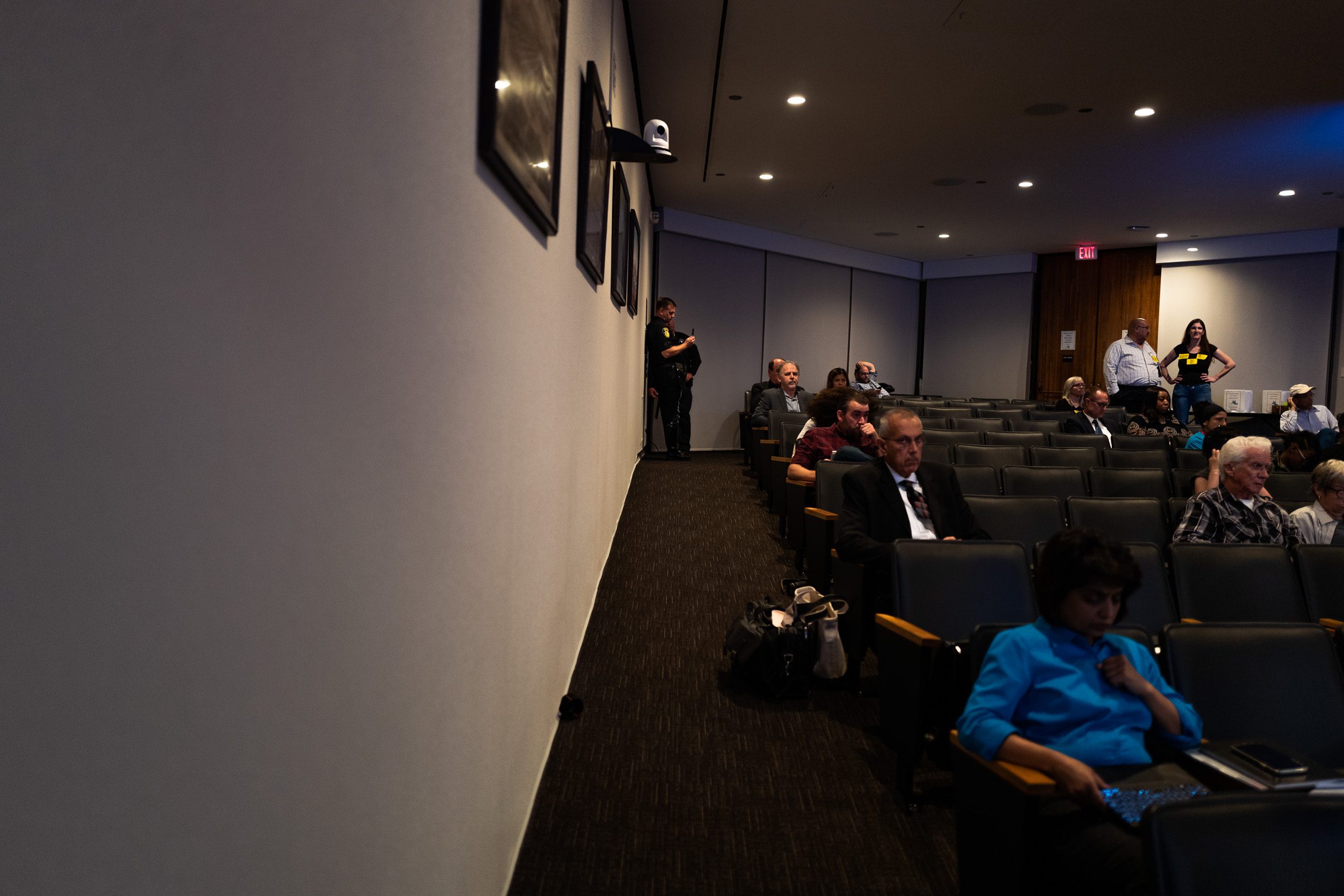 Vallejo police Lt. Michael Nichelini records civil rights attorney Melissa Nold with his phone as members of the city council discuss a proposed union contract on Sept. 24, 2019. Nichelini covertly filmed Nold for nearly 15 minutes as she observed the meeting, according to video obtained by Open Vallejo through a public records request. He is now the union’s president despite being fired for threatening a reporter and for sharing a picture of a Vallejo police badge engraved with a swastika.