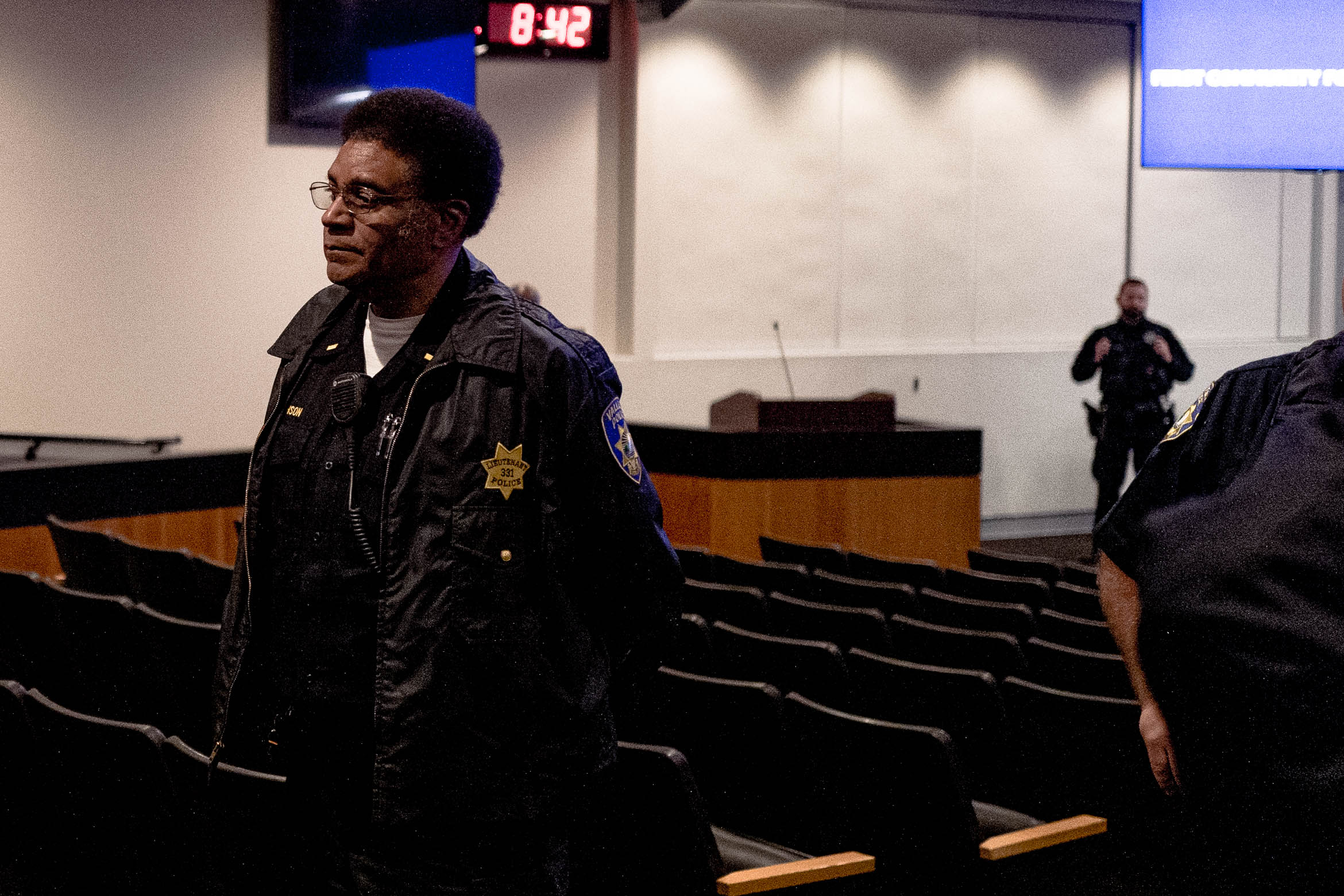 Lt. Herman Robinson helps clear the city council chamber after police declared an unlawful assembly at Vallejo City Hall on May 14, 2019.