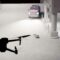 A 3D rendering of a DJI Mavic 2 Pro drone hovering over a 3D-rendered scene that includes a man lying dead in front of an undercover police truck.