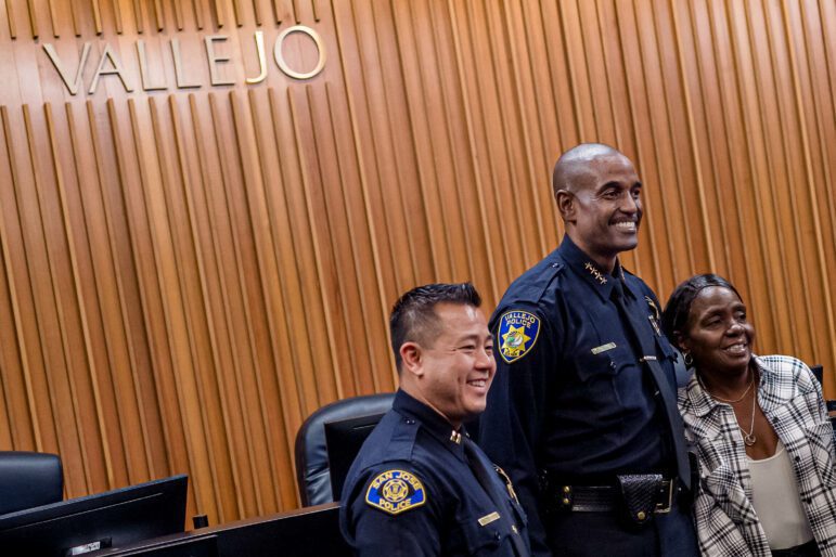 Then-San Jose Police Department Capt. Jason Ta, left, poses in the Vallejo City Council chambers for a photograph with Vallejo Police Chief Shawny Williams minutes after Williams was sworn in as Vallejo's police chief on Nov. 12, 2019. In 2021, Williams recruited Ta to serve as his deputy chief of police.