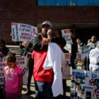 Members of Willie McCoy's family hug in front of Vallejo City Hall during a protest on Feb. 28, 2019, three weeks after Vallejo police killed the 20-year-old.