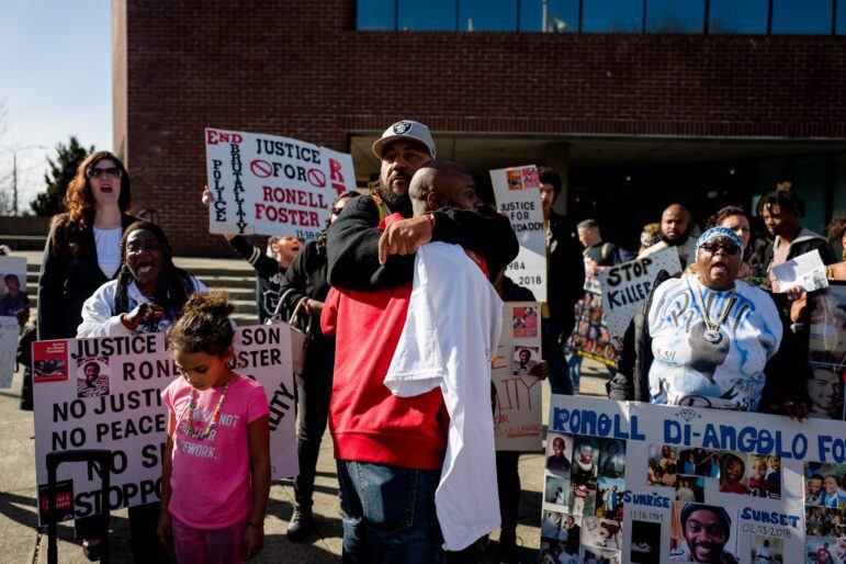 Members of Willie McCoy's family hug in front of Vallejo City Hall during a protest on Feb. 28, 2019, three weeks after Vallejo police killed the 20-year-old.