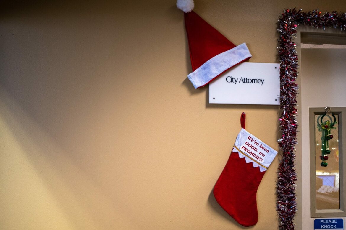 A stocking hanging outside the Vallejo City Attorney’s office on Dec. 21, 2022 reads, “We’ve been GOOD, we PROMISE!!” In September, Deputy City Attorney Katelyn Knight hired a firm to uncover the identities of authors behind two social media accounts, an Open Vallejo investigation has found.