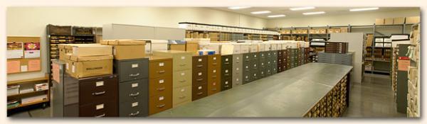Rows of archived records in a large room.