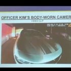 A presentation that shows a gray Dodge Charger from body camera footage and the text, "Officer Kim's body worn camera"