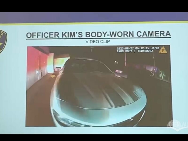 A presentation that shows a gray Dodge Charger from body camera footage and the text, "Officer Kim's body worn camera"