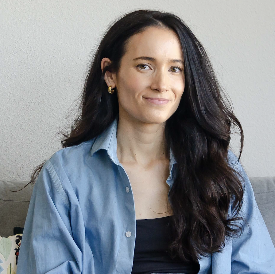 A professional headshot of Sarah Hopkins