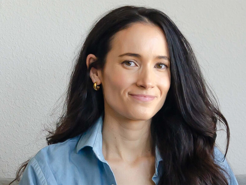 A professional headshot of Sarah Hopkins