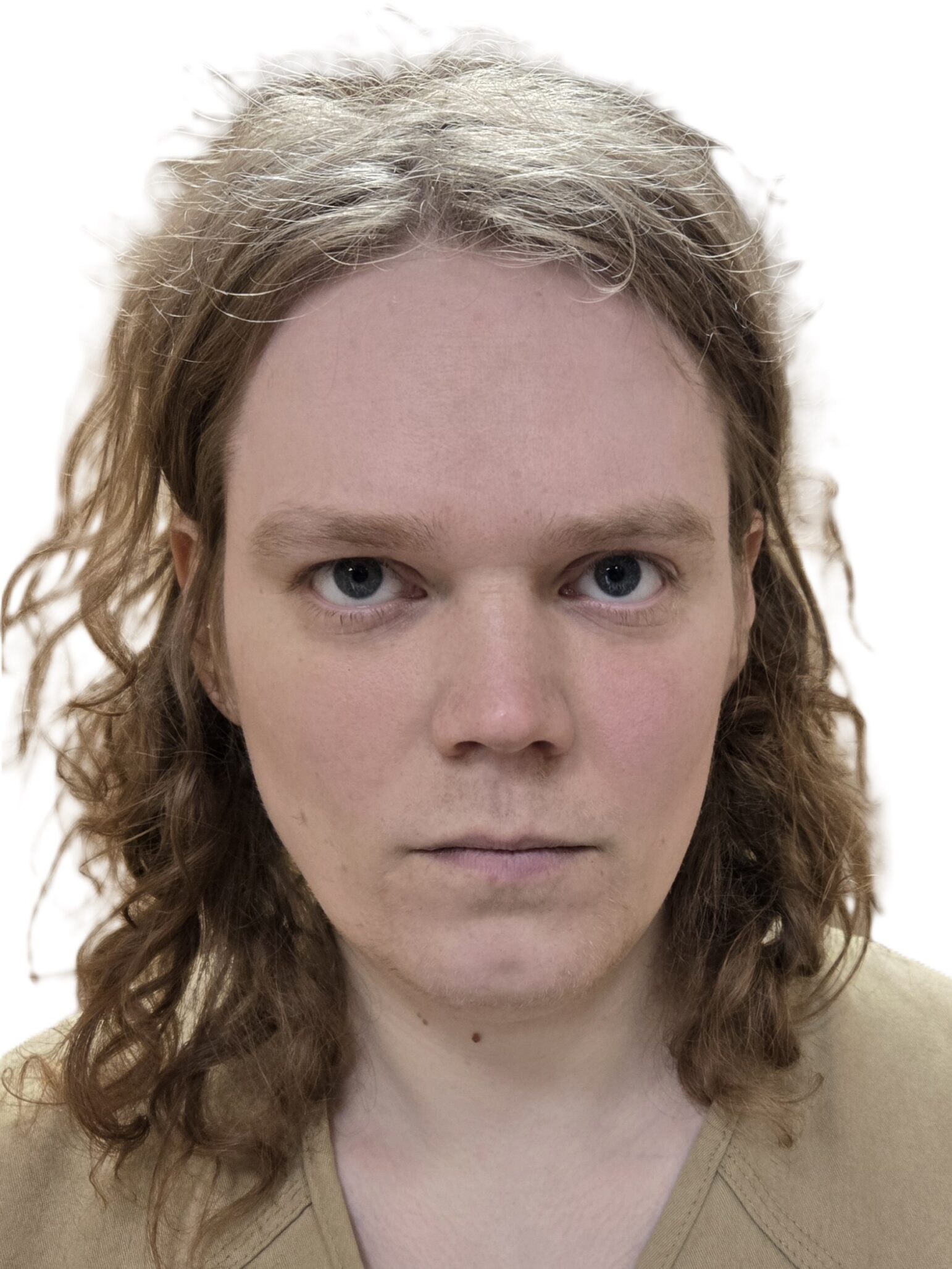 A booking photo shows a person with shoulder-length wavy hair wearing a beige shirt, looking directly at the camera with a neutral expression. The background is plain and white.