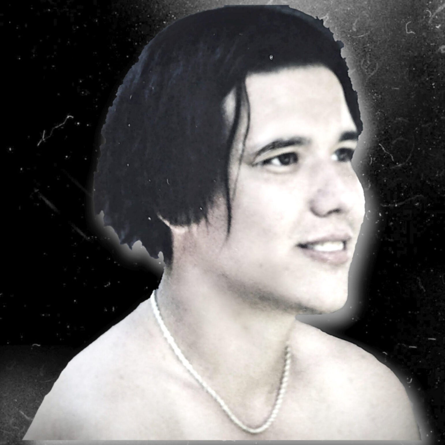 Portrait-style image of a young man with short dark hair, a faint smile, and a pearl necklace, shown shirtless against a dark textured background with a soft glowing outline around him.